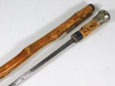 A knotty wood walking stick with concealed sword