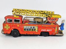 A vintage tinplate fire engine