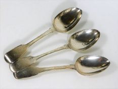 A Georgian silver tablespoon twinned with two earl
