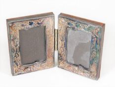 A small double silver photo frame mounted in woode