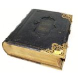 A 19thC. bible with brass fittings