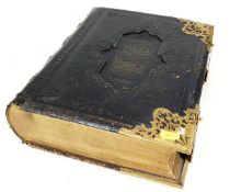 A 19thC. bible with brass fittings