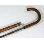 A traditionally shaped walking cane with concealed