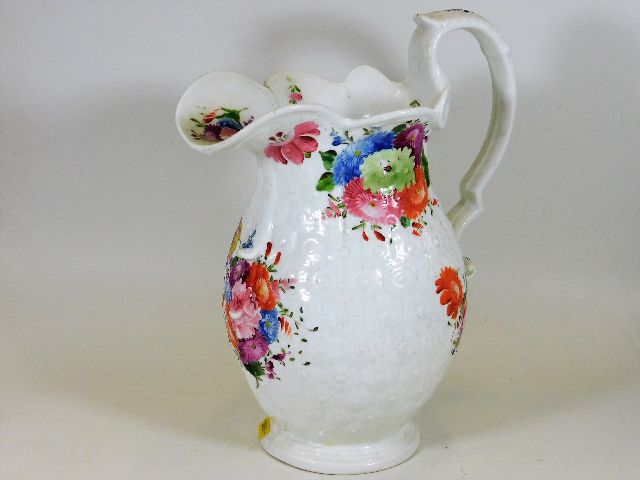 A large 19thC. Swansea style pottery foot bath jug with both relief & hand painted floral decor 13.2