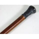 A malacca cane stick with embossed white metal kno
