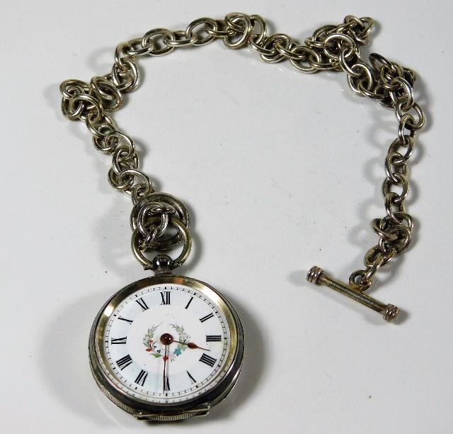 A ladies Swiss silver pocket watch & chain with fl