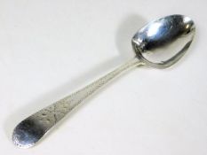 A Georgian bright cut silver table spoon
