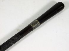 A rosewood walking cane with silver collar