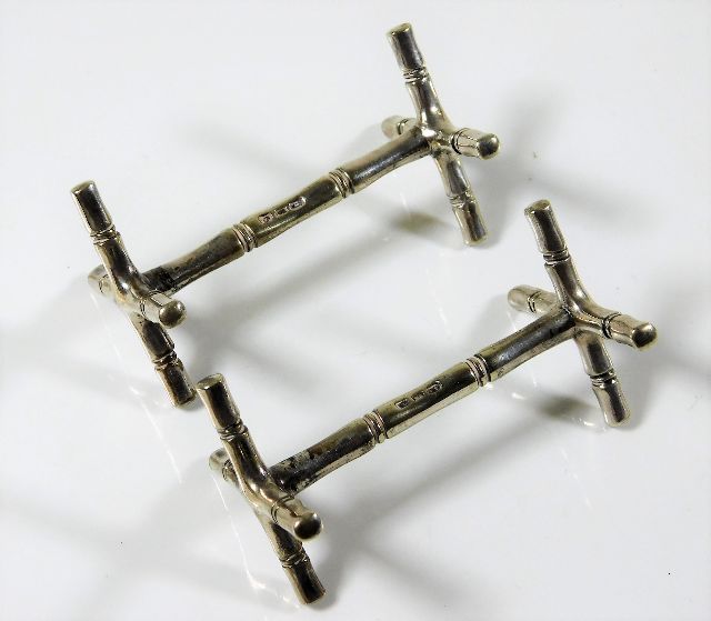 A pair of Chinese silver bamboo knife rests