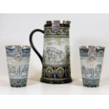 A good Hannah Barlow Doulton Lambeth silver mounted stoneware lemonade set depicting cattle comprisi