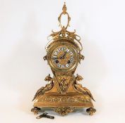 A gilt bronze mantel clock with key