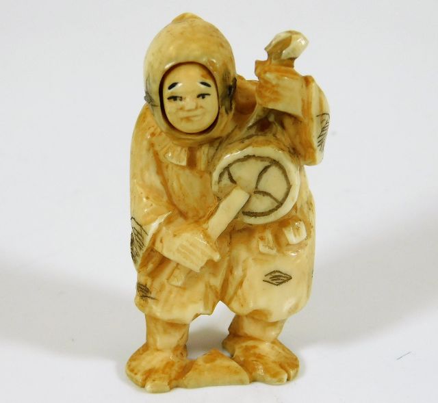 A c.1900 Japanese carved ivory netsuke with happy