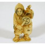 A c.1900 Japanese carved ivory netsuke with happy