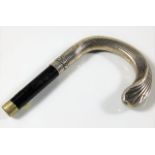A decorative French silver cane handle