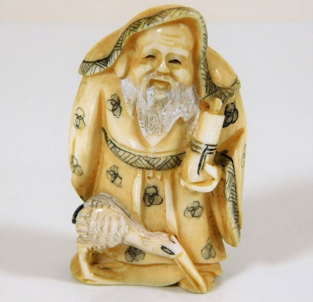 A c.1900 Japanese carved ivory of wise old man wit