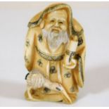 A c.1900 Japanese carved ivory of wise old man wit