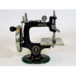 A miniature Singer sewing machine 6.5in tall