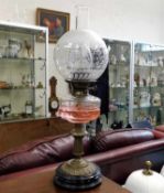 A Victorian oil lamp & shade