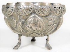 A 19thC. Burmese silver bowl on feet decorated wit