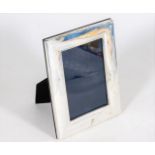 A modern sterling silver photo frame with box