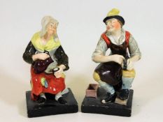 Two 19thC. Burslem style figures depicting man pol