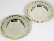 Two plain silver dishes of heavy gauge