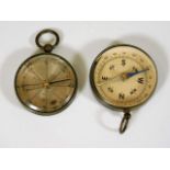 Two small early 20thC. brass cased compasses