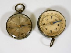 Two small early 20thC. brass cased compasses