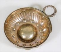 A French silver tastevin with stylised snake handl