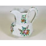 A 19thC. pottery jug with hand painted floral deco
