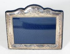 A decorative modern silver photo frame