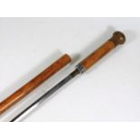 A malacca cane walking stick with concealed sword