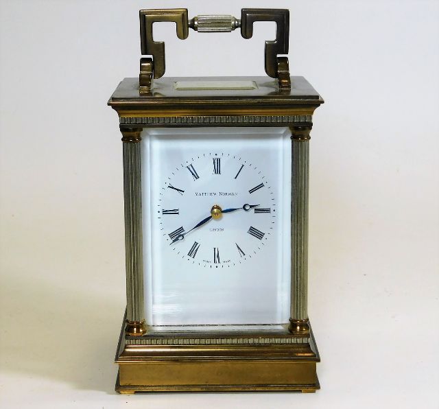 A large Matthew Norman London brass carriage clock