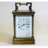 A large Matthew Norman London brass carriage clock