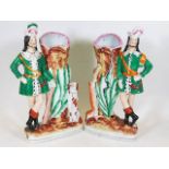 A pair of 19thC. Staffordshire spills depicting hu