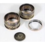 A silver scarf ring, two silver napkin rings & a U