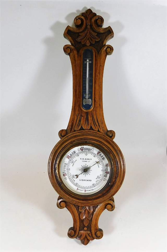 An early 20thC. oak cased barometer R. H. Sibly, P