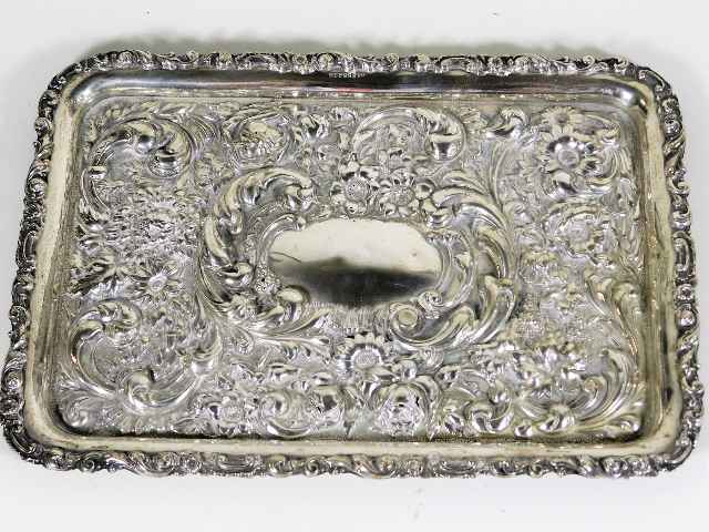 An embossed silver tray, some faults 11.5in wide