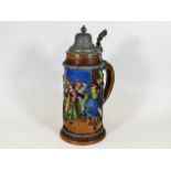 A 1920's German stoneware stein with colourful rel