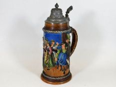 A 1920's German stoneware stein with colourful rel