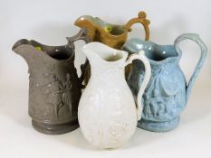 Four c.19thC. pottery jugs with heavy relief figur