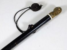 A Gentleman's walking cane with brass figurative f