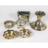 A pair of silver salts, a silver candlestick & thr