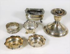 A pair of silver salts, a silver candlestick & thr