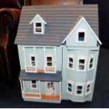 A 20thC. dolls house, 27in high x 21in wide