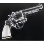 A novelty glass replica revolver