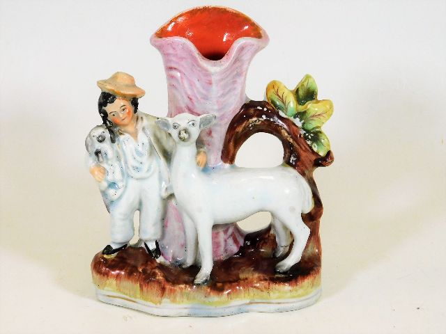 A 19thC. Staffordshire spill vase with boy, dog &