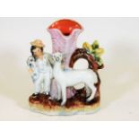 A 19thC. Staffordshire spill vase with boy, dog &