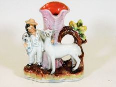 A 19thC. Staffordshire spill vase with boy, dog &