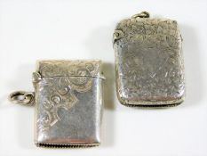 Two small silver vestas both with chased decor